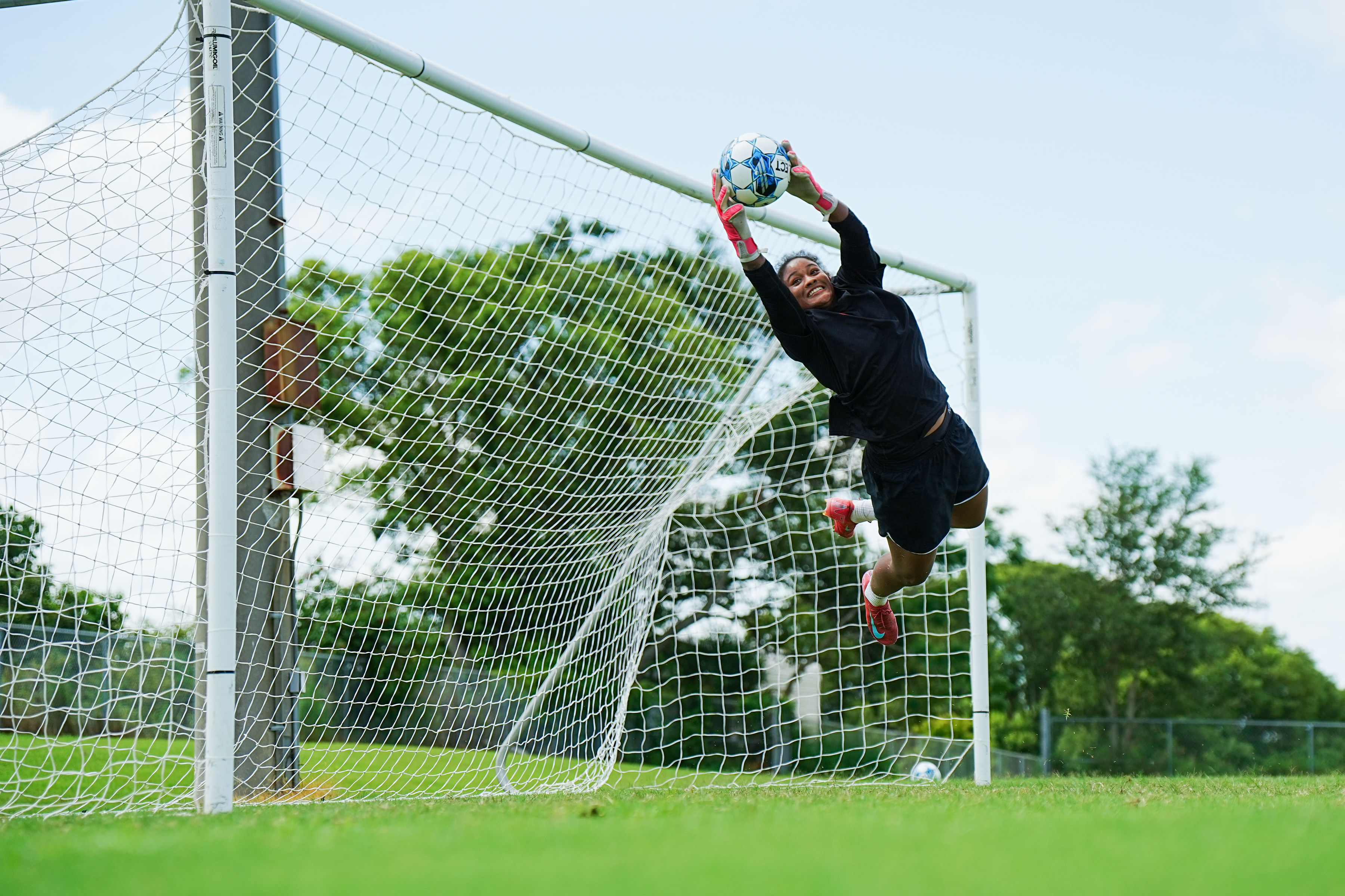 Goalkeeper diving to make a save